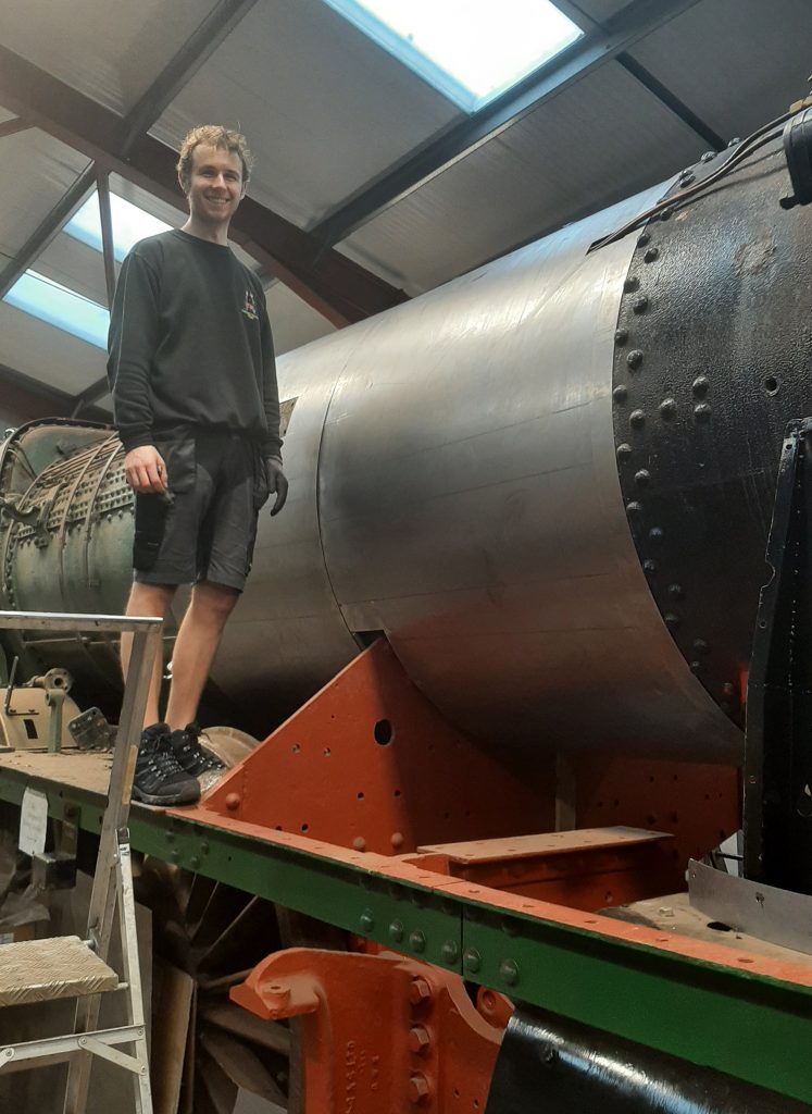 Sam standing by the first two right hand steel sheets fitted