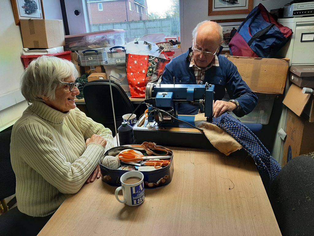Anne and Phil Burton progressing the upholstery on GER 5 in the mess roomi