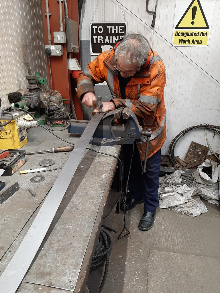 Keith riveting a boiler band cleat