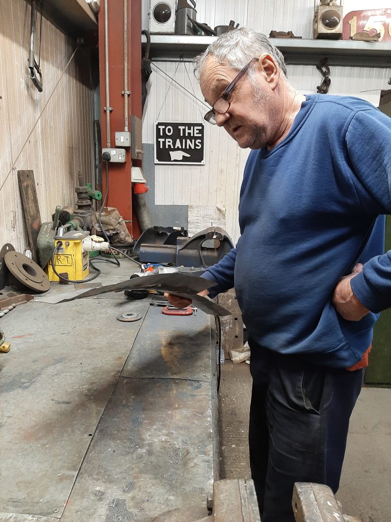 Keith with a tricky piece of metalwork for Wootton Hall's cladding