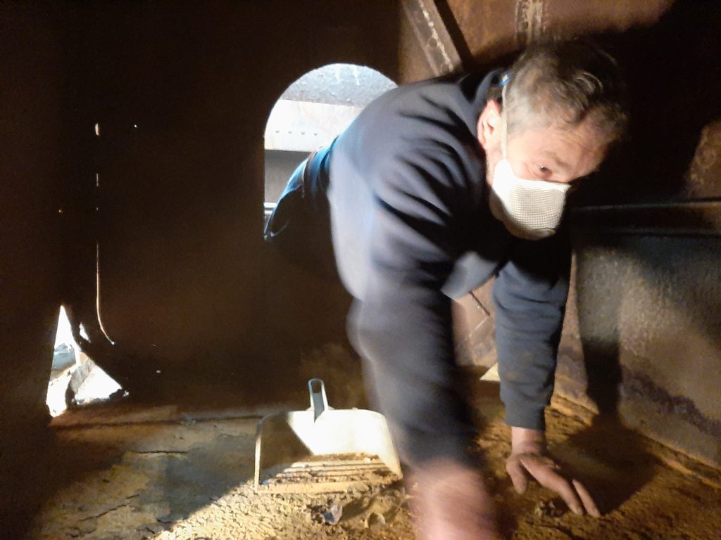 Keith cleaning inside Wootton Hall's tender tank