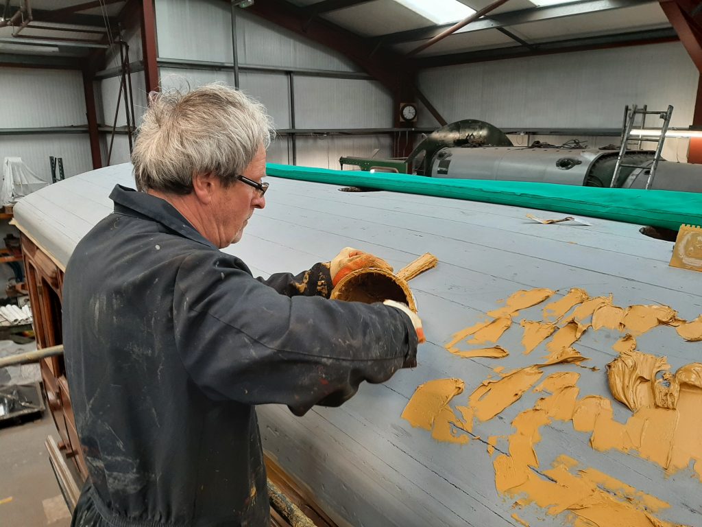 Paul Balshaw placing the stodgy yellow peril on the roof of GER No. 5