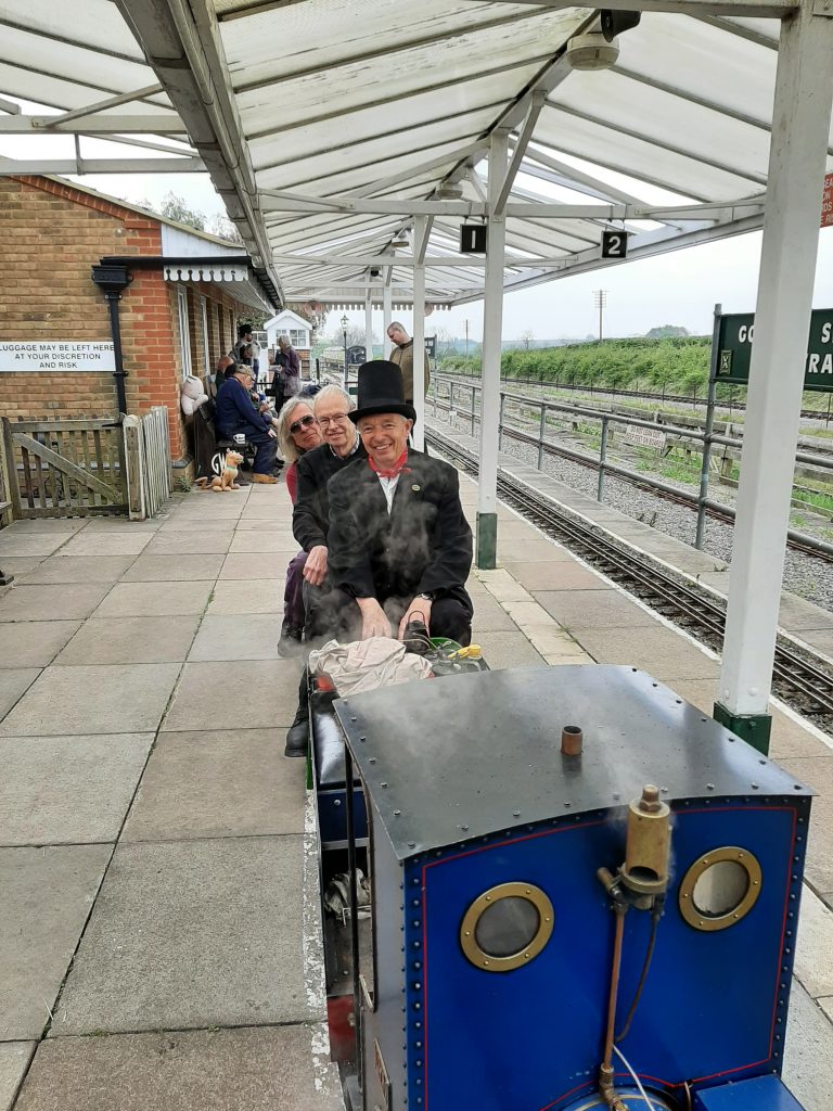 Ade, John and Tim taking a seat on the miniature railway at Quainton