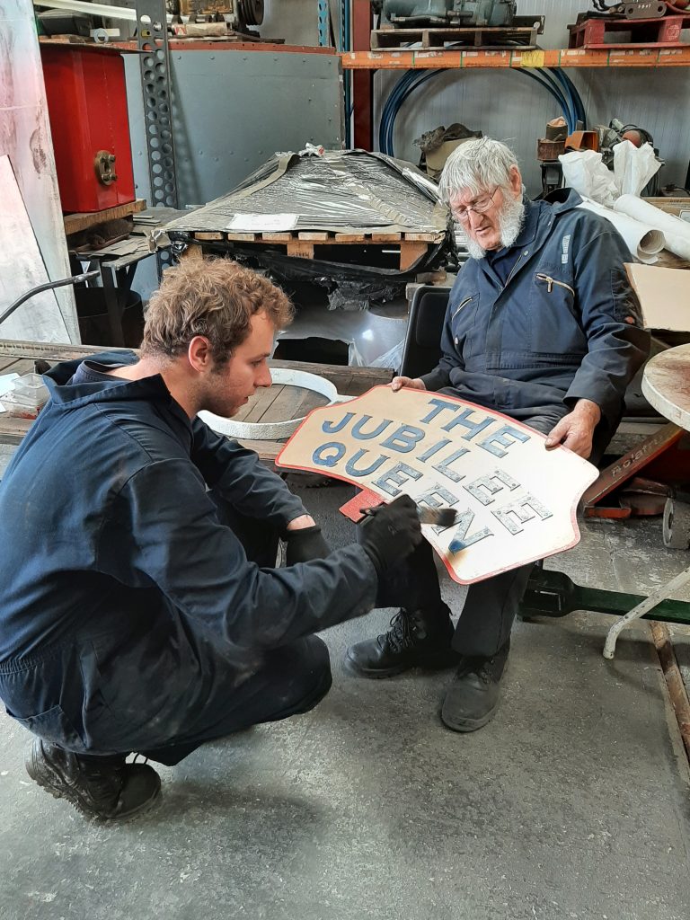 Sam cleaning up the Jubilee Queen headboard - hope he doesn't wake up Alan!