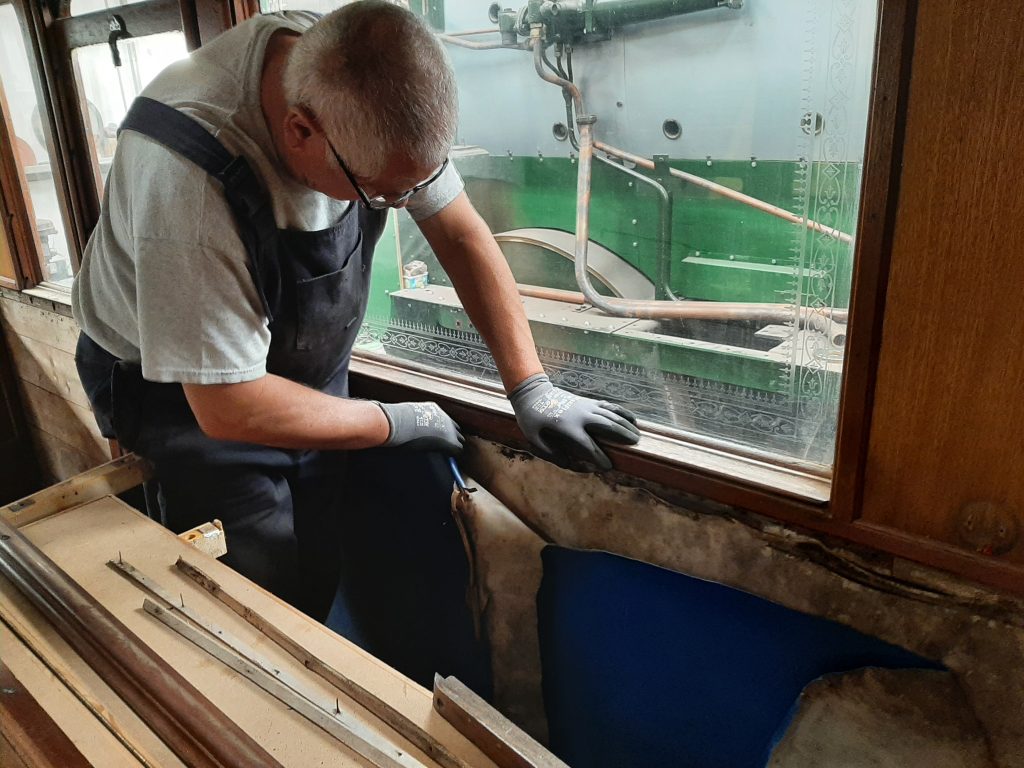 John Davis removing old leatherette from the interior of GER No. 5