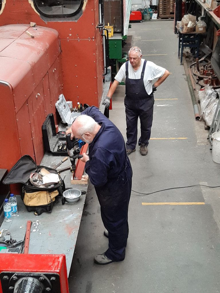 Phil Bell drilling holes in the new bridging piece for Fluff's cab roof.