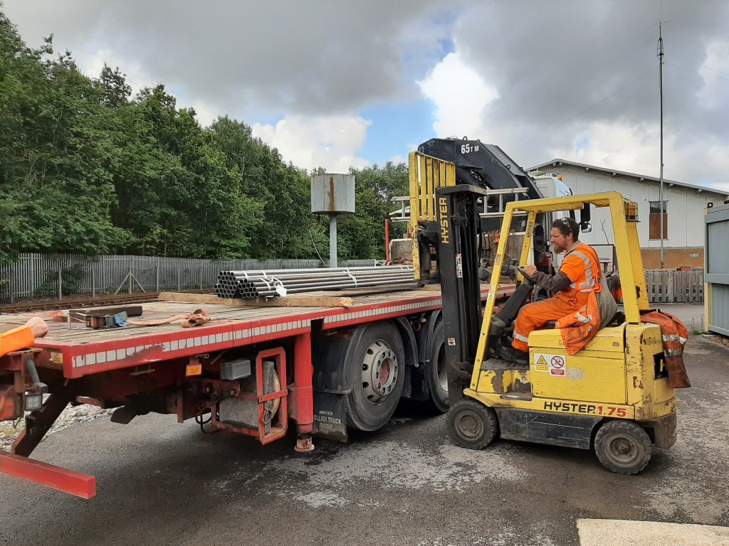 Matt Crabtree loading Cumbria's new tubes at Preston for transportation to Embsay