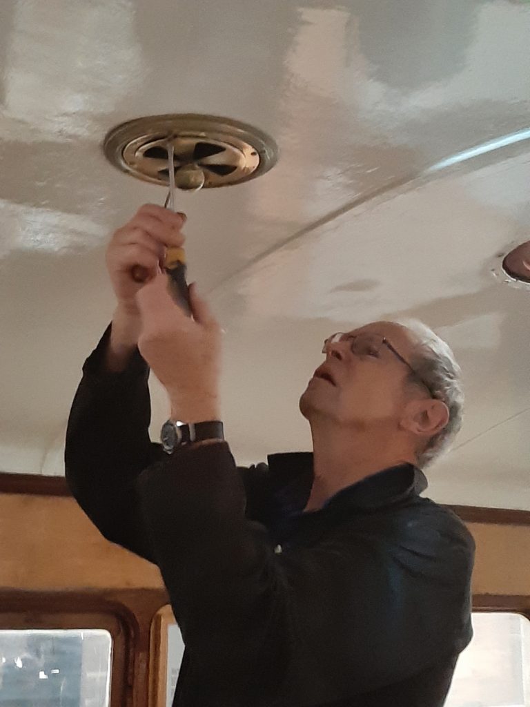 John Dixon re-fits a ceiling vent in GER 5
