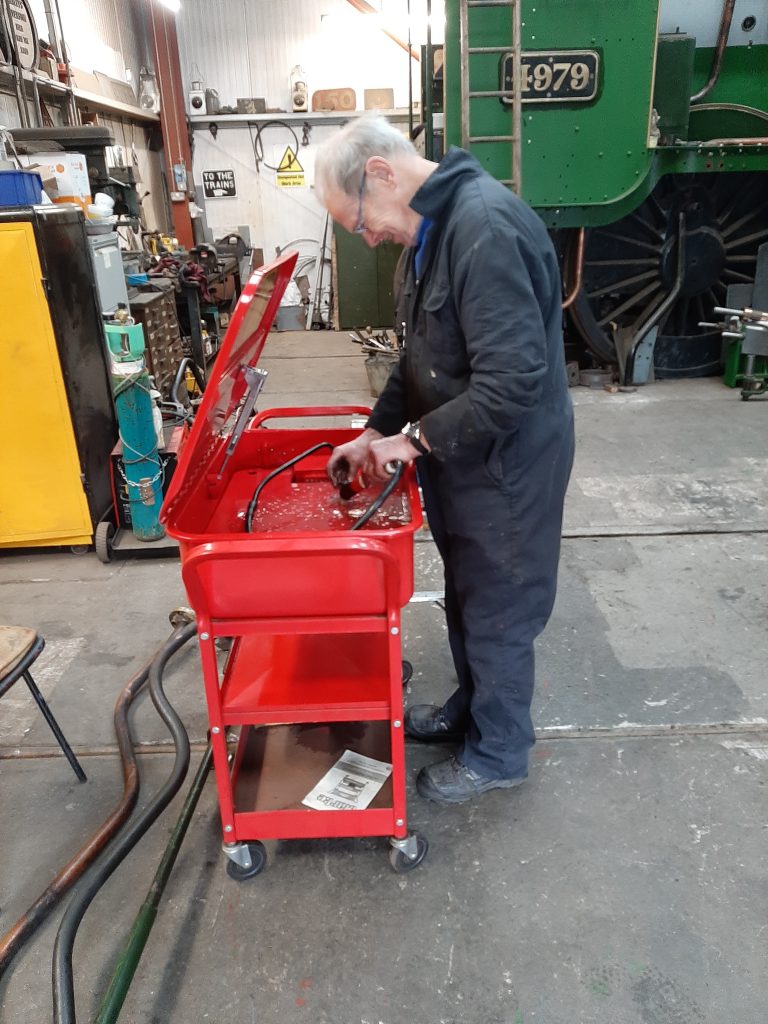John Dixon busy with the parts cleaner