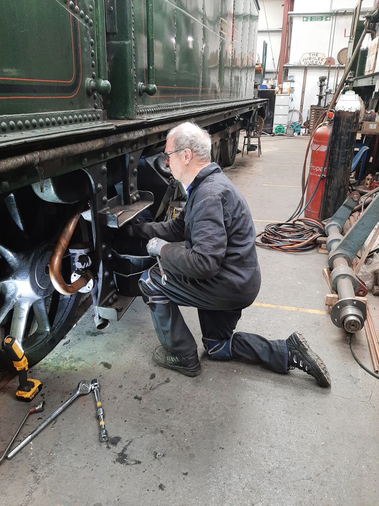 John Dixon draining off the remaining water from the side tanksl