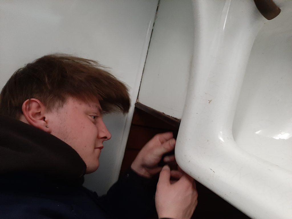 Matthew cleaning the royal sink