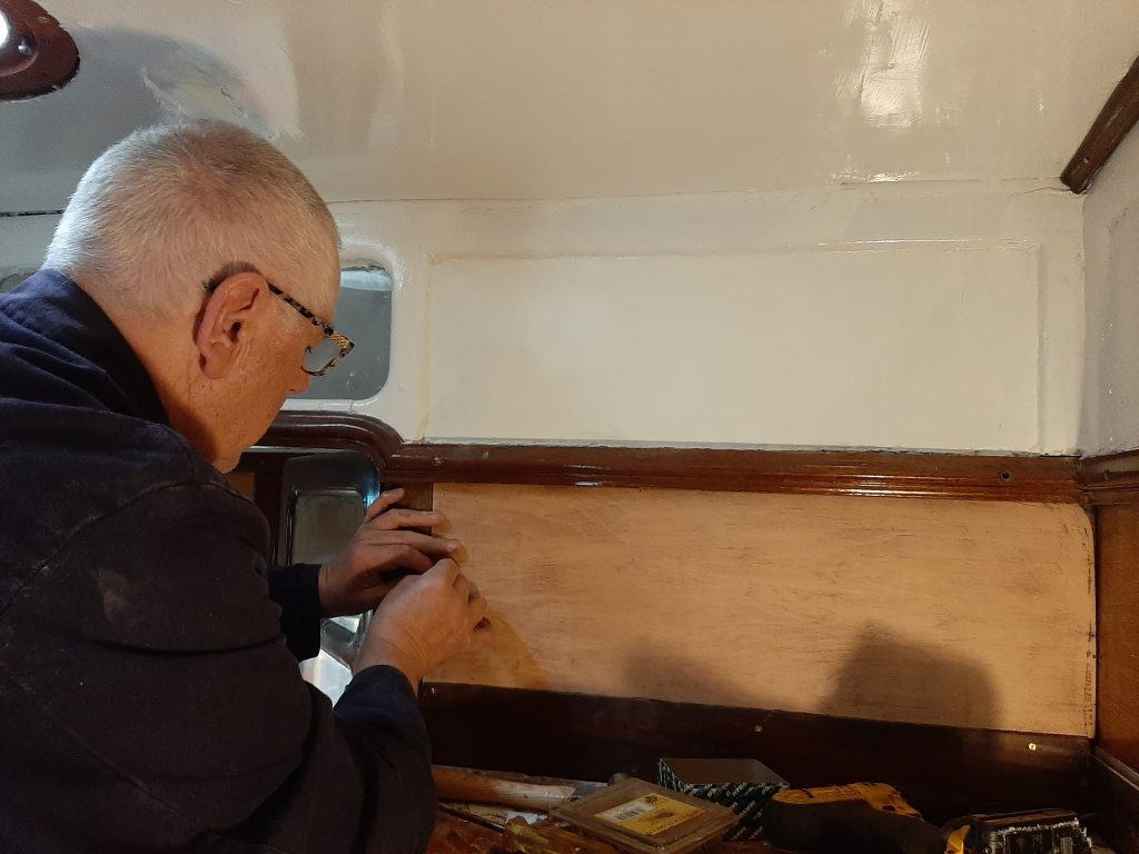 John Davis replacing veneer in the guard's compartment