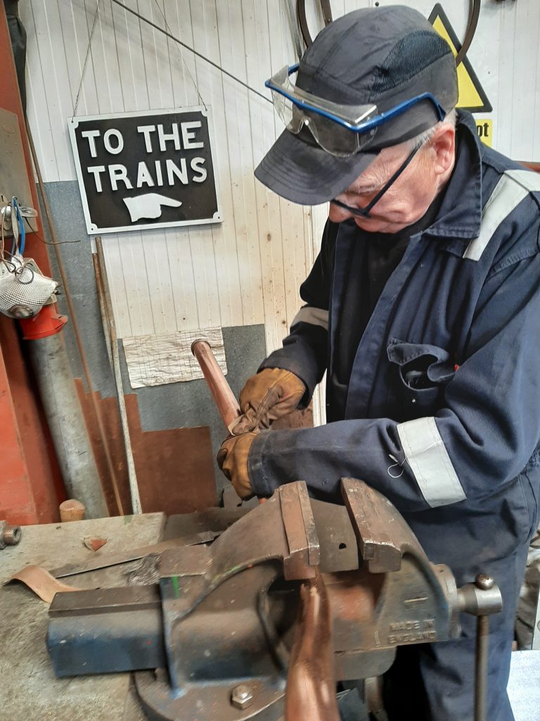 Ron Crowe polishing the injector pipework