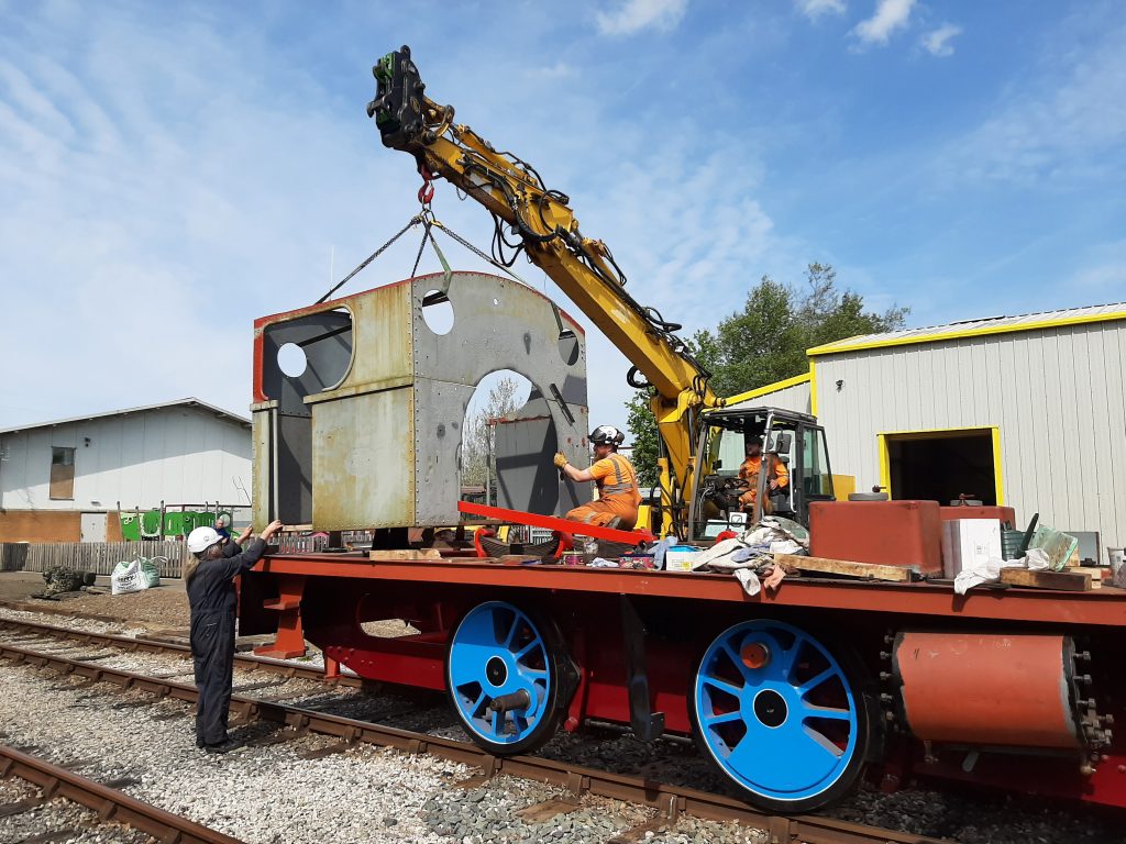 Caliban's cab being lowered onto the frames