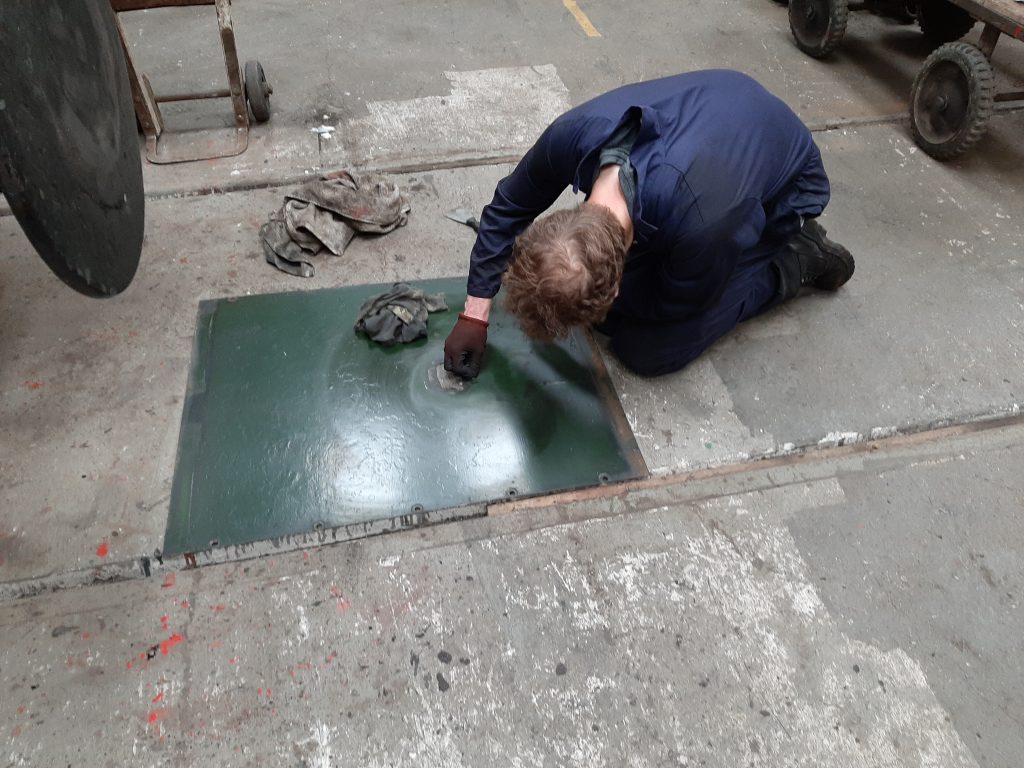 Sam cleaning the firebox top cladding