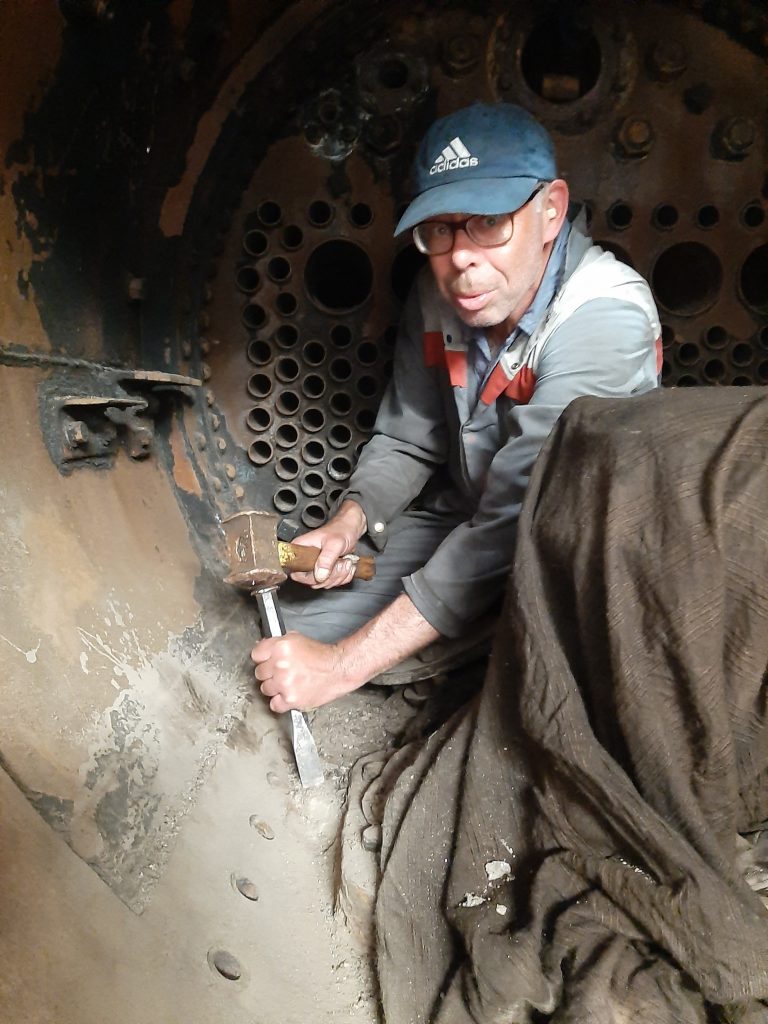 Alen Johnson removing concrete from 5643's smokebox