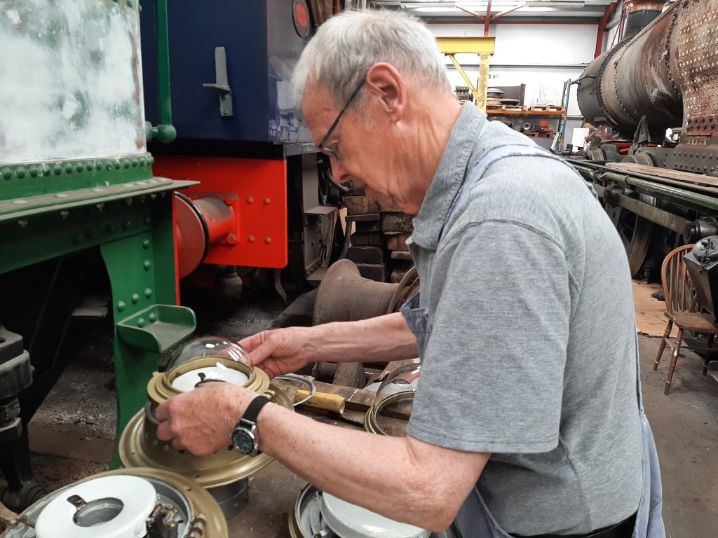 John Dixon working on one of the light fittings