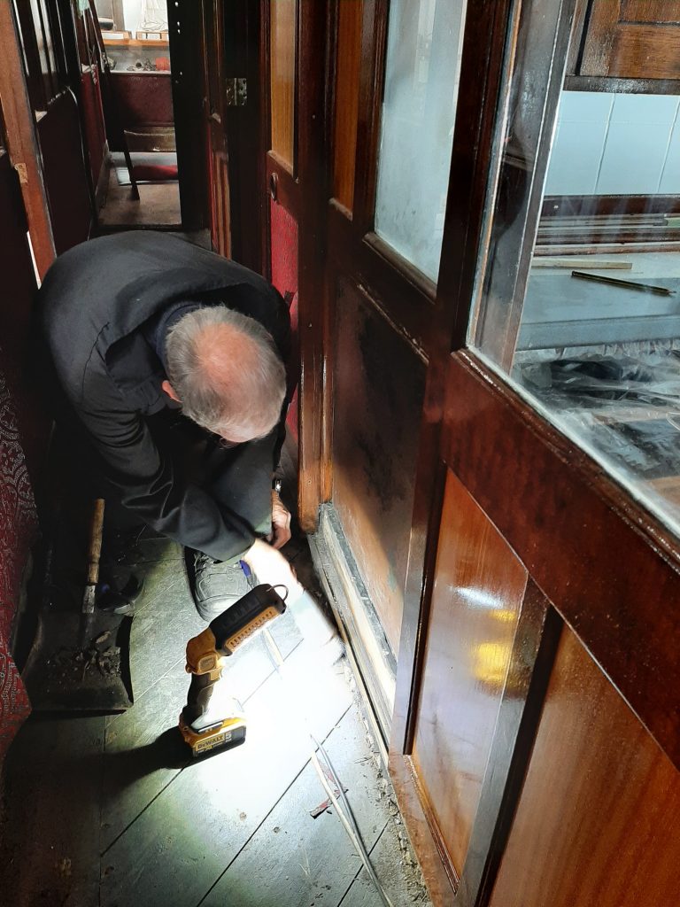 John Dixon cleaning up the corridor floor of GER No. 5