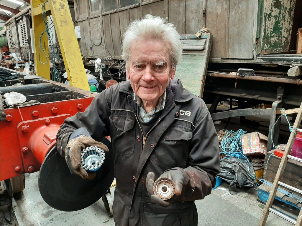 Fred demonstrating that a cup wire brush has to be completely bald before asking for a new brush!