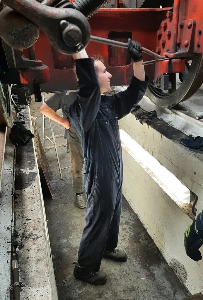 Sam working to remove on of 5643's radial springs
