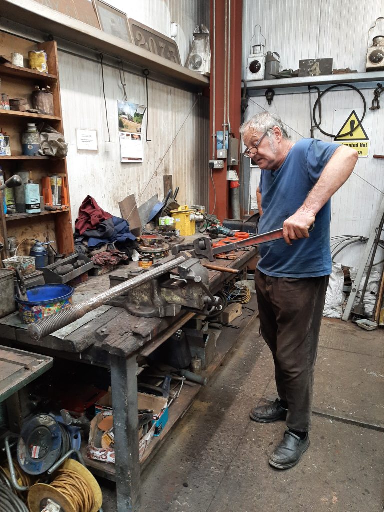 Keith removing stubborn nuts from one of 5643's spring hangers