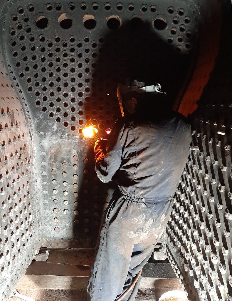 Andy Booth cutting out the old tubes from 5643's boiler