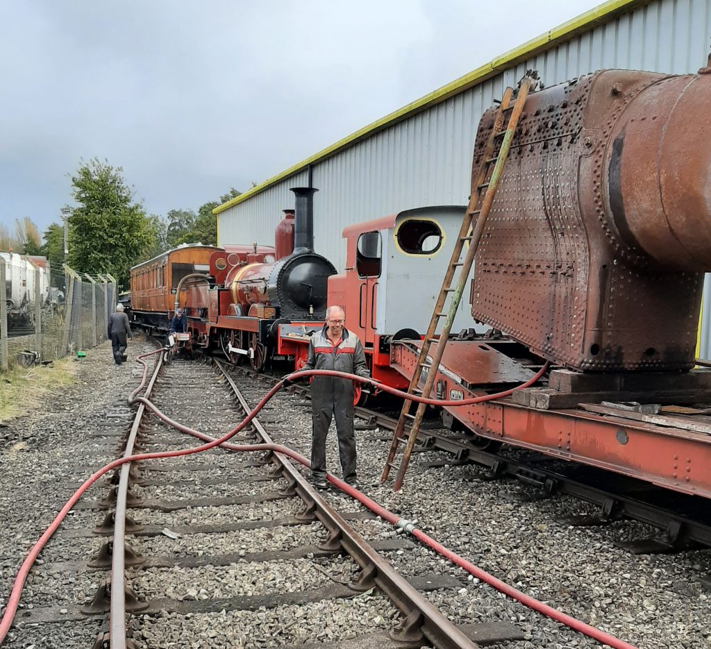 The ensemble of FRT rolling stock with Alen Johnson holding the hose