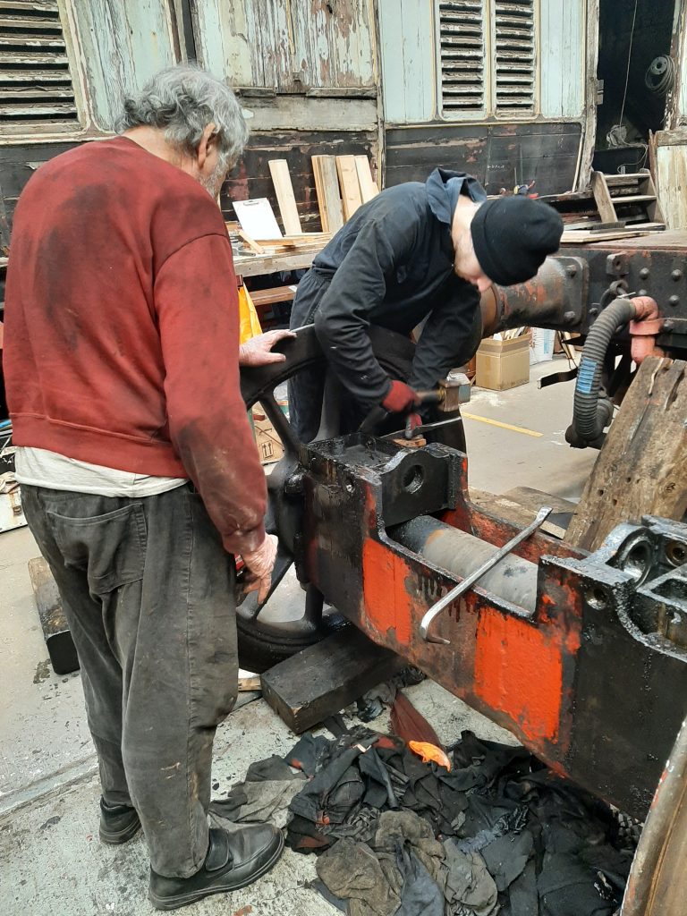 Keith Brewer and Sam Middleton working to dismantle the radial truck