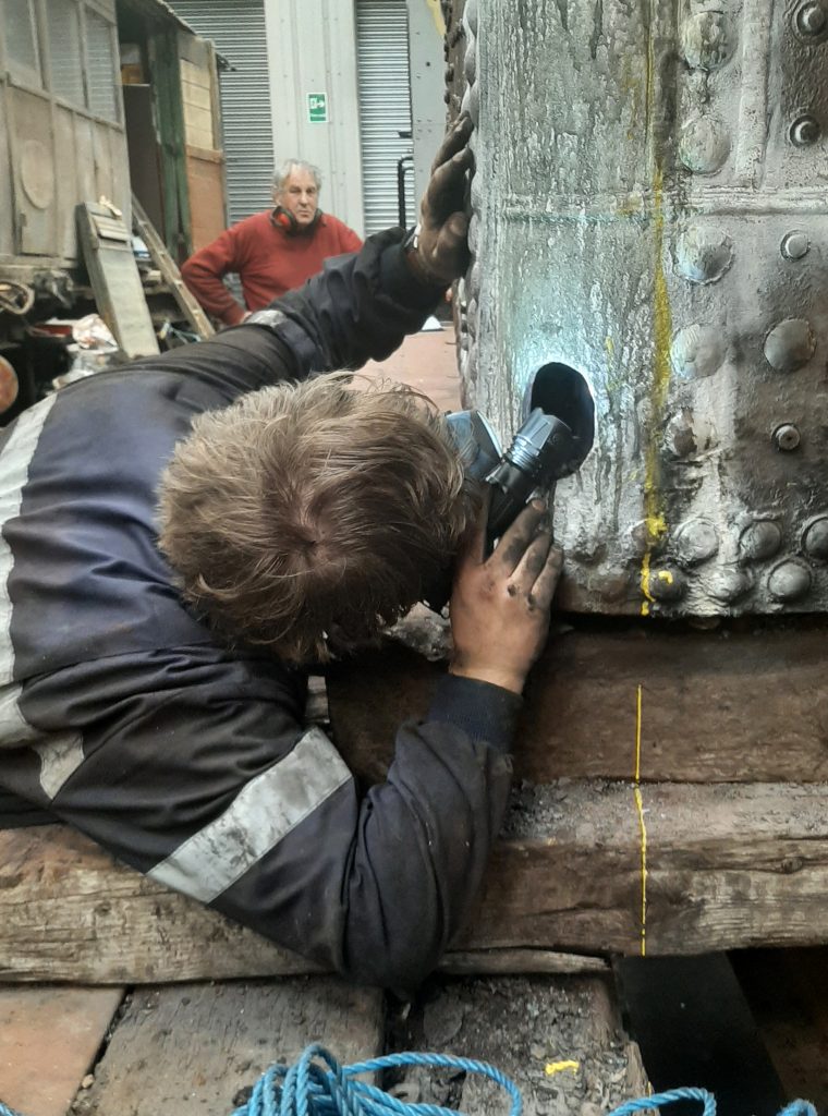 Keith looks on as Adam Wright inspects 5643's boiler