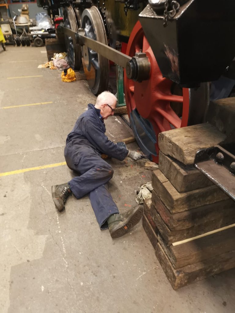 Jon Dixon painting one of 5643's wheels