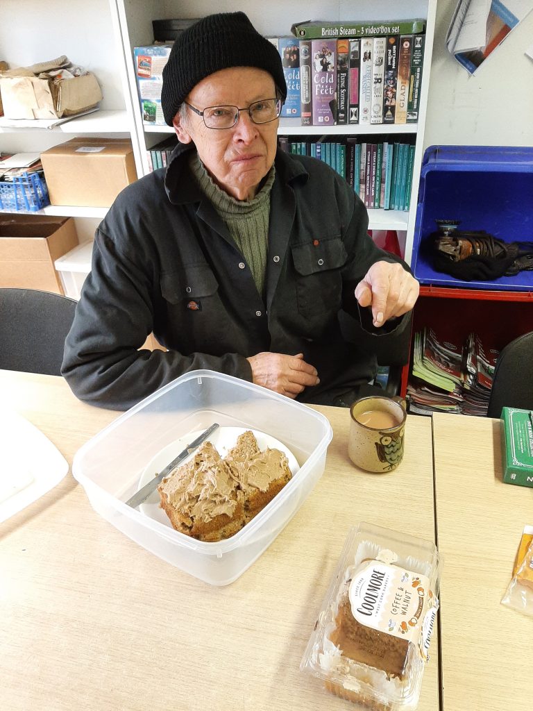 John Dixon sampling some of the birthday cake on offer