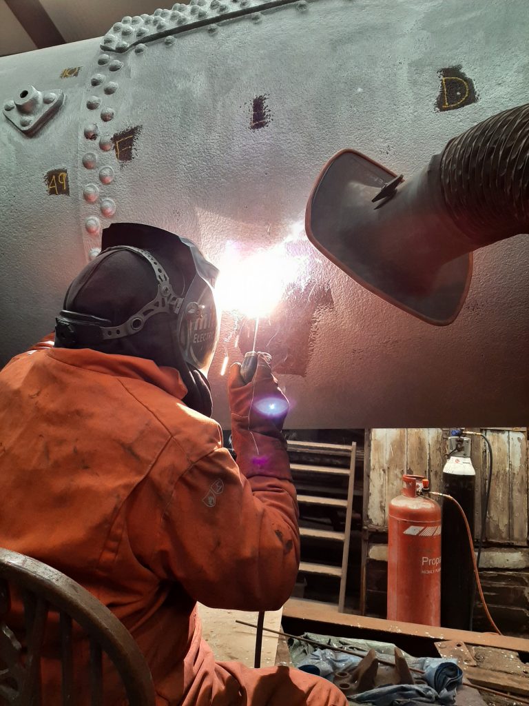 Ian Massey welding up 5643's boiler barrel