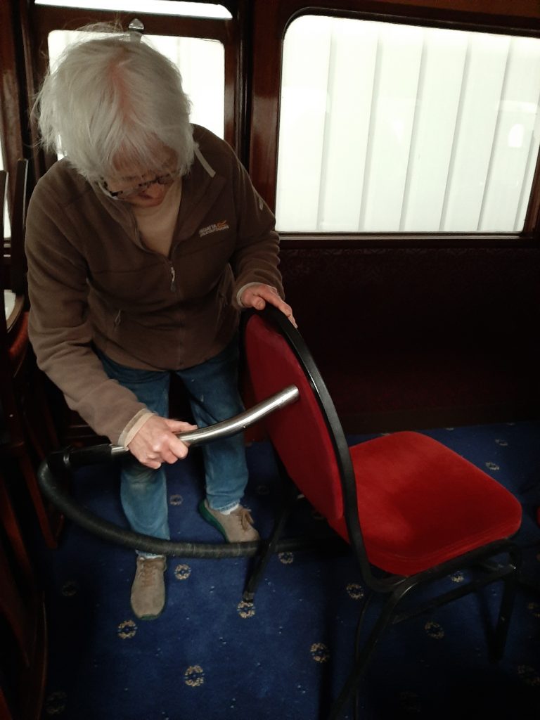 Anne Burton cleans one of the seats in GER 5