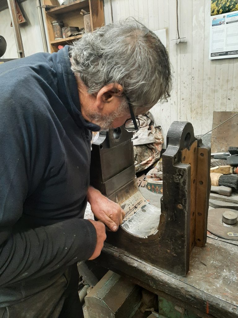 Keith Brewer scraping the white metal on one of 5643's axleboxes