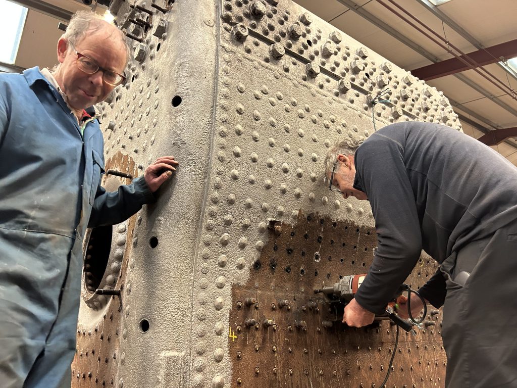 Allen Johnstone looks on as Keith drills out one 5643's stays