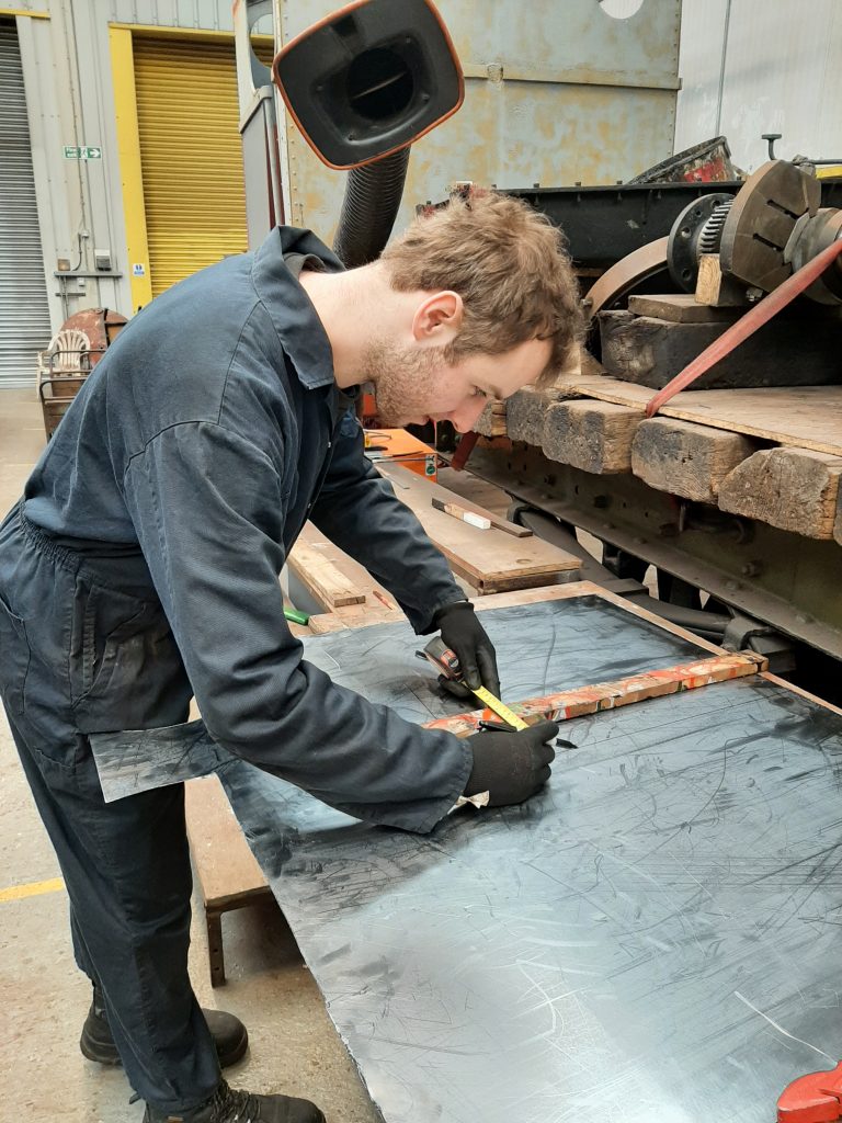 Sam preparing joints for Caliban's valve covers. That is quite some protrusion from his neck!