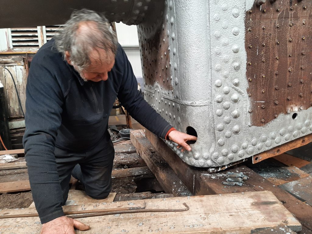 Keith clearing stay debris from 5643's firebox