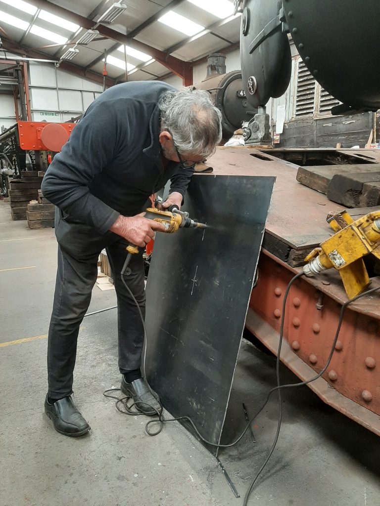 Keith drilling holes in the new plate for Wootton Hall's tender tank