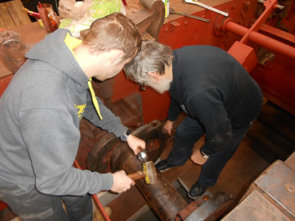 Alan and Sam working to remove an eccentric strap on Caliban