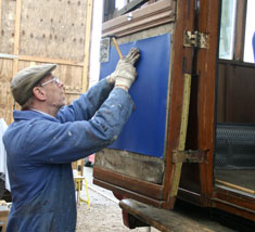 David Rimmer attaches upholstery to one of the doors